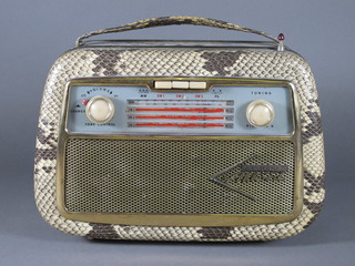 An Ackroyd portable radio contained in a snakeskin effect finished case