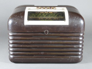 A Bush portable radio type DAC10 contained in a brown Bakelite  case  ILLUSTRATED
