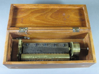 A cylinder musical box contained in a mahogany case 12"