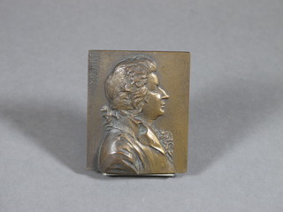 A rectangular bronze plaque decorated a portrait of Mozart 3" x 2"