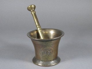 A bell metal mortar and pestle decorated a double headed eagle  4"