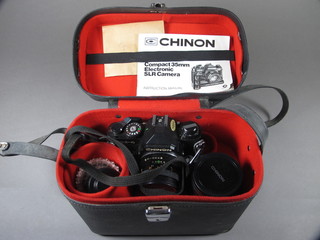 A Chinon camera with auto chinon lens marked 1:1.9 and 1 other  lens marked 1:3.5 cased