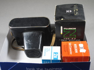 A Zenith Moshda.80 camera with a Helios-44M 2/58 lens and a  Fujica Fujinon:3.5-4.2 lens, a Helio Tel converter and a  Photax autotel converter x2