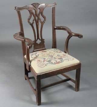 A Chippendale style carver chair with pierced vase shaped slat back and H framed stretcher, raised on square tapering supports