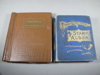 A blue Lincoln stamp album and a brown Movaleaf album