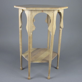 An Art Nouveau bleached mahogany octagonal 2 tier occasional  table, raised on turned supports 18"w x 24"h