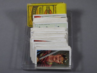 A quantity of various cigarette cards