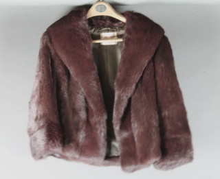 A lady's short fur jacket by A Dunkin