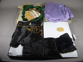 A childs green velvet bolero jacket decorated coins and a "coin" belt, a childs Oriental suit etc