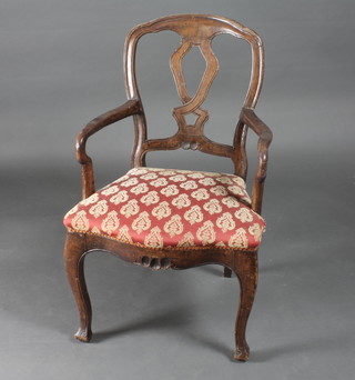 A Continental walnut open arm chair with slat back and  upholstered seat, raised on cabriole supports
