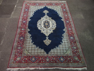 A fine quality blue and red ground Persian carpet with central medallion 88" x 56"