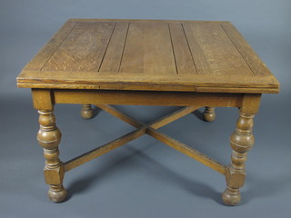 An oak refectory style drawleaf dining table raised on turned and bulbous supports with X framed stretcher 14 1/2"w x 44"d x  29"h