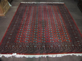 A brown ground Bokhara carpet with 161 octagons to the centre  118" x 101"