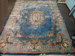 A blue and floral patterned Chinese carpet 157" x 120"