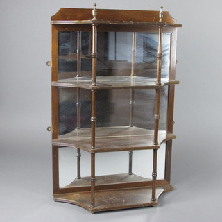 A Georgian style mahogany 4 tier corner hanging shelf with mirrored back raised on turned supports 18"w x 7"d x 26 1/2"h