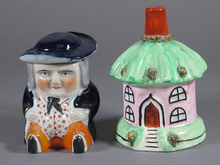 A Staffordshire pastel burner in the form of a cottage 4" and a jar and cover in the form of a seated stout gentleman 3"