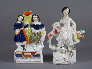 A Staffordshire flat back vase decorated 2 girls, the base with locomotive decoration 5 1/2" - chipped and a Staffordshire figure  of a standing lady with Spaniel 6"