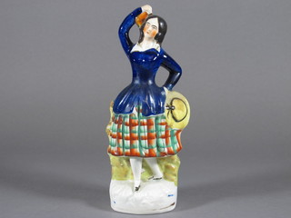 A Staffordshire figure of a standing Scots girl 9"