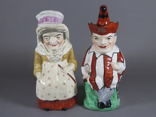A pair of 19th Century Staffordshire jugs in the form of Punch  and Judy 11", f and r,  ILLUSTRATED