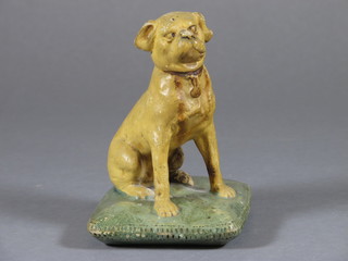 A Victorian pottery figure of a seated dog with cushion 4"