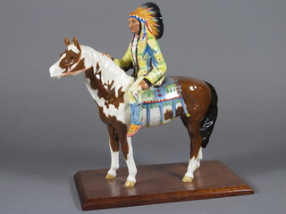 A Beswick figure of a mounted Red Indian Chief 8", raised on a  wooden base  ILLUSTRATED