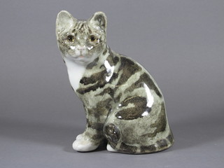 A pottery figure of a seated cat with glass eyes 8"