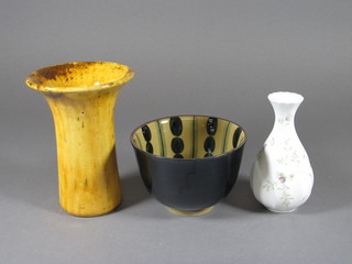 A Wedgwood club shaped vase with floral decoration 4", a  yellow glazed Art Pottery vase 6" and an Art Pottery bowl 5"