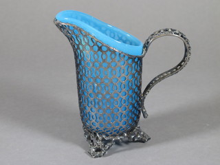 A blue glass jug with pierced silver plated mount 5"