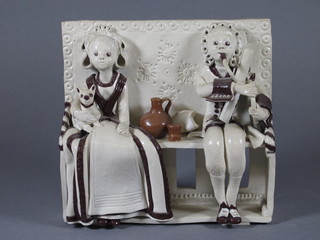 A resin figure group of a lady and gentleman playing instruments  6"
