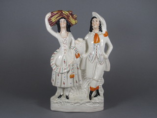 A Staffordshire flat back figure group of a standing lady and gentlemen 12"
