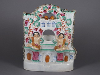 A 19th Century Staffordshire flat back watch stand 10"