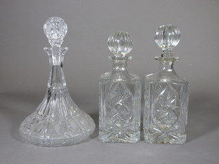 A pair of cut glass spirit decanters and a cut glass ships decanter