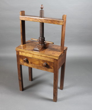 A Georgian mahogany book press fitted a drawer and raised on  square tapering supports 26"w x 15"d x 53"h  ILLUSTRATED