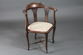 An Edwardian inlaid mahogany corner chair with slat back,  raised on cabriole supports with X framed stretcher