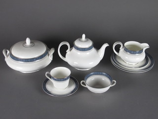 A Sherbrooke pattern 56 piece dinner service comprising 2  vegetable tureens and covers 8 1/2", an oval meat plates 13 1/2",  6 dinner plates 10", 6 side plates 8", 6 bowls 8", 12 tea plates 6  1/2" - 1 cracked, 6 twin handled soup bowls, 6 cups and 6  saucers - 5 saucers are seconds, twin handled plate 9" - a second,  teapot, sugar bowl - second, cream jug - second, jug and stand
