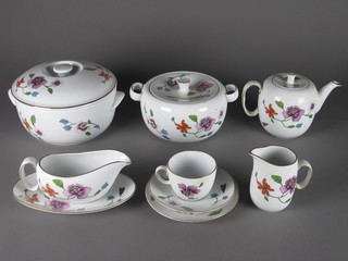 A 51 piece Royal Worcester Astley pattern dinner/tea service comprising circular vegetable tureen and cover 9", pair of  vegetable tureens and covers 7", 8 dinner plates 10" - 1 with chip  to rim and gilding rubbed, 5 soup bowls 9", 3 soup bowls 8", 9  side plates 8", 5 tea plates 6 1/2" - rubbed and with contact  marks, sauce boat and stand, teapot, cream jug and sugar bowl, 5  saucers, 8 cups