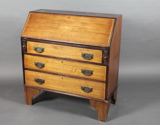 An Edwardian inlaid mahogany bureau the fall front revealing a  well fitted interior above 3 long graduated drawers, raised on  bracket feet 36"w x 39"h x 17"d