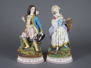 A pair of 19th Century biscuit porcelain figures of 2 standing ladies 12"
