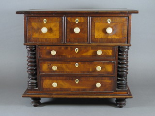 A Victorian mahogany apprentice chest fitted 4 long drawers with ivory handles and escutcheons and turned columns to the sides,  raised on turned feet 18"w x 11"d x 15"h   ILLUSTRATED