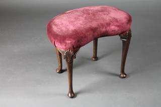 A walnut Queen Anne style kidney shaped dressing table stool, raised on cabriole supports 22"