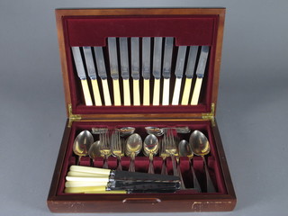A canteen box containing a collection of Old English silver plated flatware