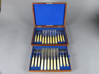 A canteen of 12 silver plated fish knives and forks