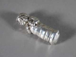 A Continental white metal scent bottle in the form of a baby 3"