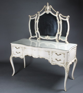 A Louis style dressing table with triple mirror, the base of serpentine outline fitted 1 long and 4 short drawers, raised on  cabriole supports 49"w x 21"d x 63"h