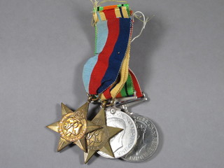 A group of 4 medals comprising 1939-45 Star, Africa Star,  Defence & War medal