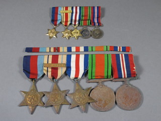 A group of 5 medals comprising 1939-45 Star, Africa Star with  bar first army, France & German Star, Defence & War medal  together with a group of miniature medals and a ribbon bar