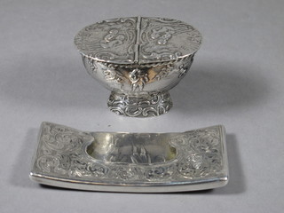 An Edwardian silver shaped card case, Birmingham 1902 and a Continental white metal boat shaped box with hinged lid