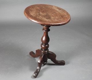 A 19th Century circular mahogany snap top wine table raised on  a turned pillar and tripod supports 19"w x 28"h