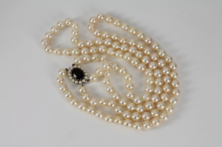 A double rope of pearls with decorative clasp