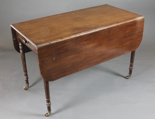 A 19th Century mahogany Pembroke table fitted a frieze drawer  and raised on turned supports 44"w x 45"h